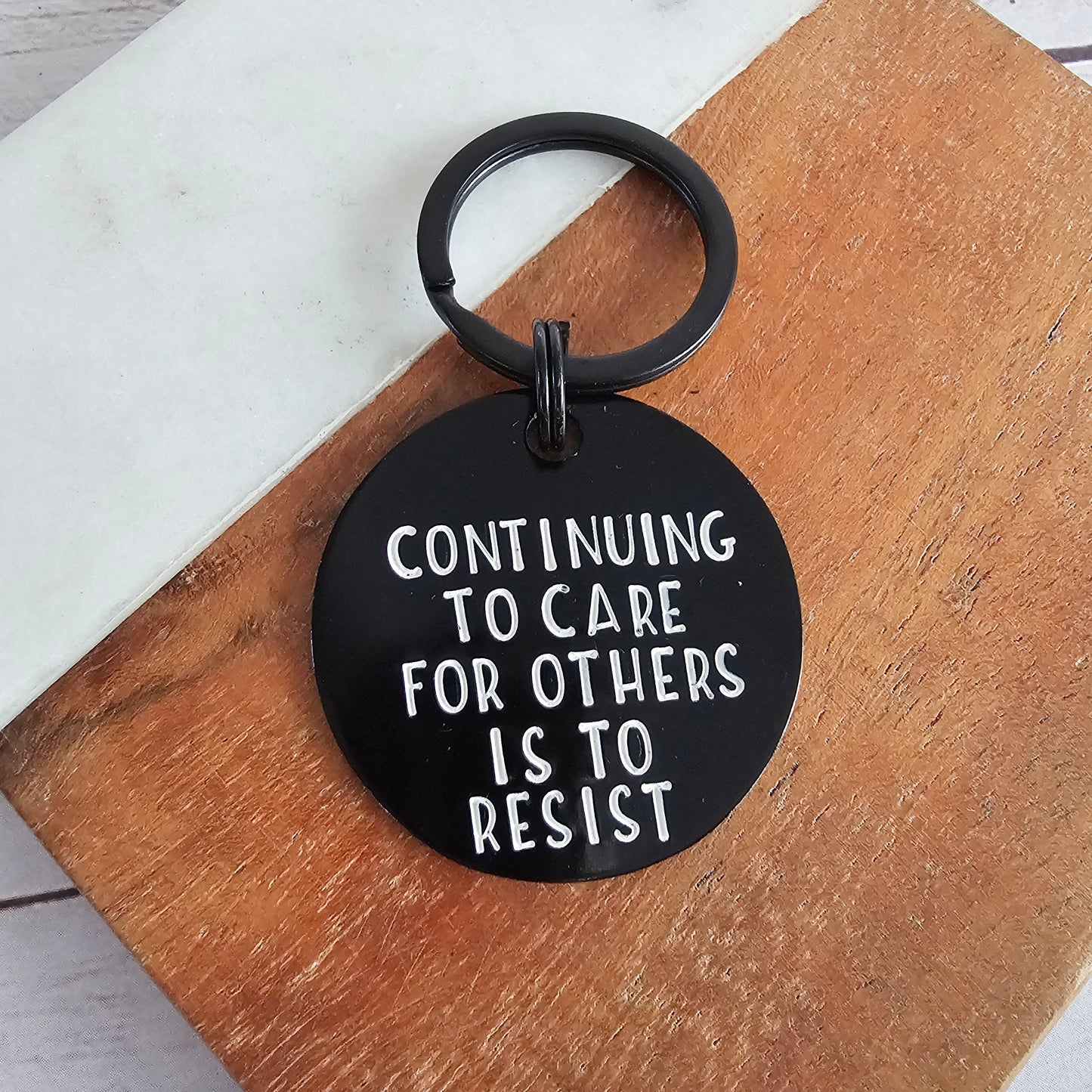 Continuing To Care For Others Is To Resist, Hand Stamped Black Metal Keychain, Antifa Gifts