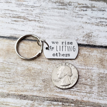 We Rise By Lifting Others Keychain