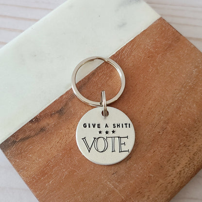 Give A Shit! Vote Keychain