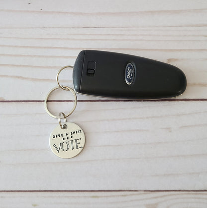 Give A Shit! Vote Keychain