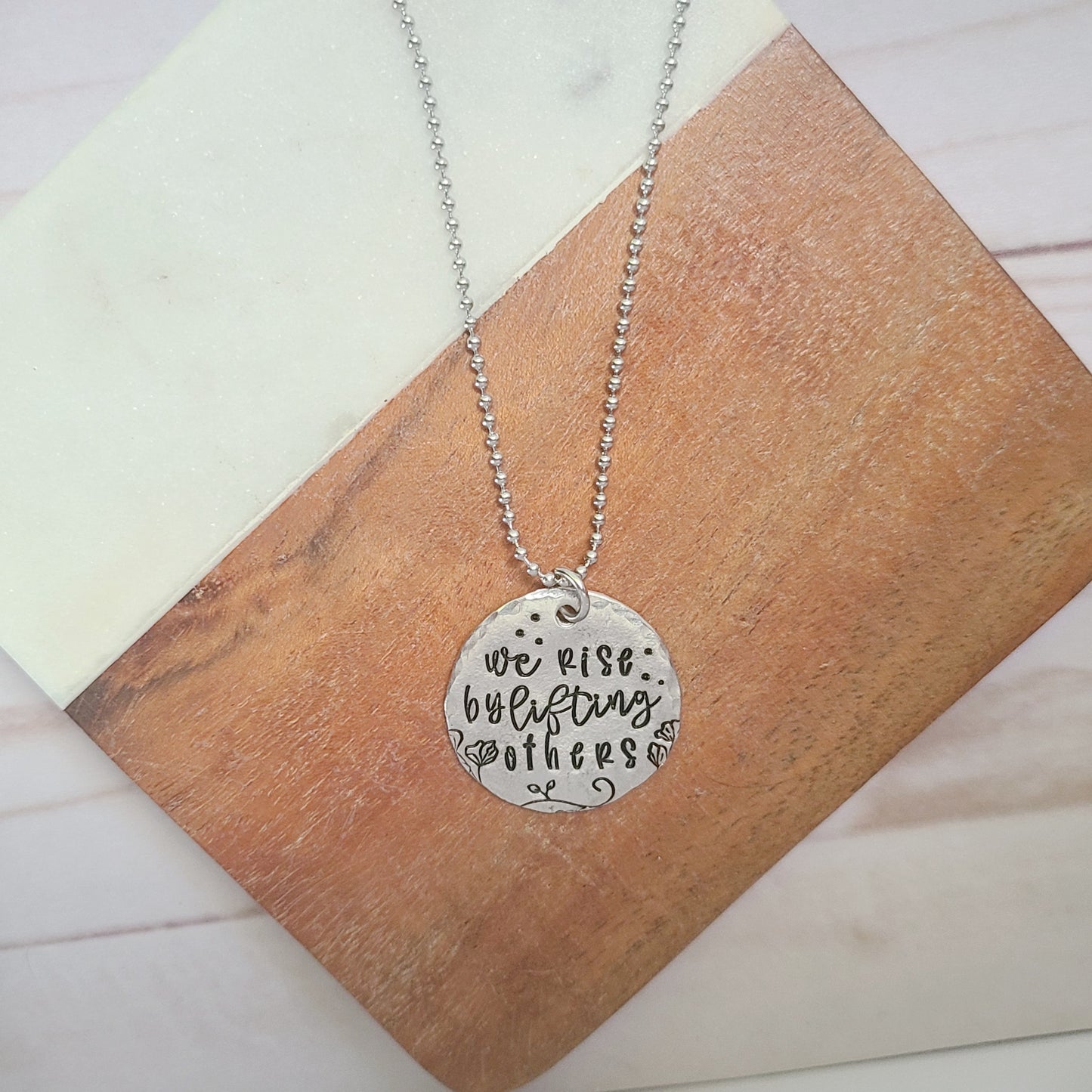 We Rise By Lifting Others Round Necklace