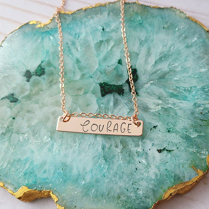 Rose Gold Plated Hand Stamped Necklace with the Word Courage Stamped on It