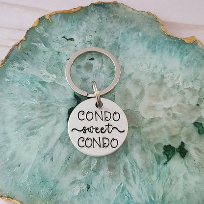 Silver Round Keychain that reads Condo Sweet Condo