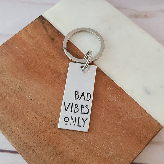 Silver Rectangle Keychain that Reads Bad Vibes Only