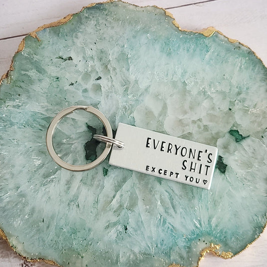 Silver Rectangle Keychain that is Hand Stamped to Read Everyone's Shit Except You