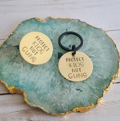 Protect Kids Not Guns Brass Pin or Keychain